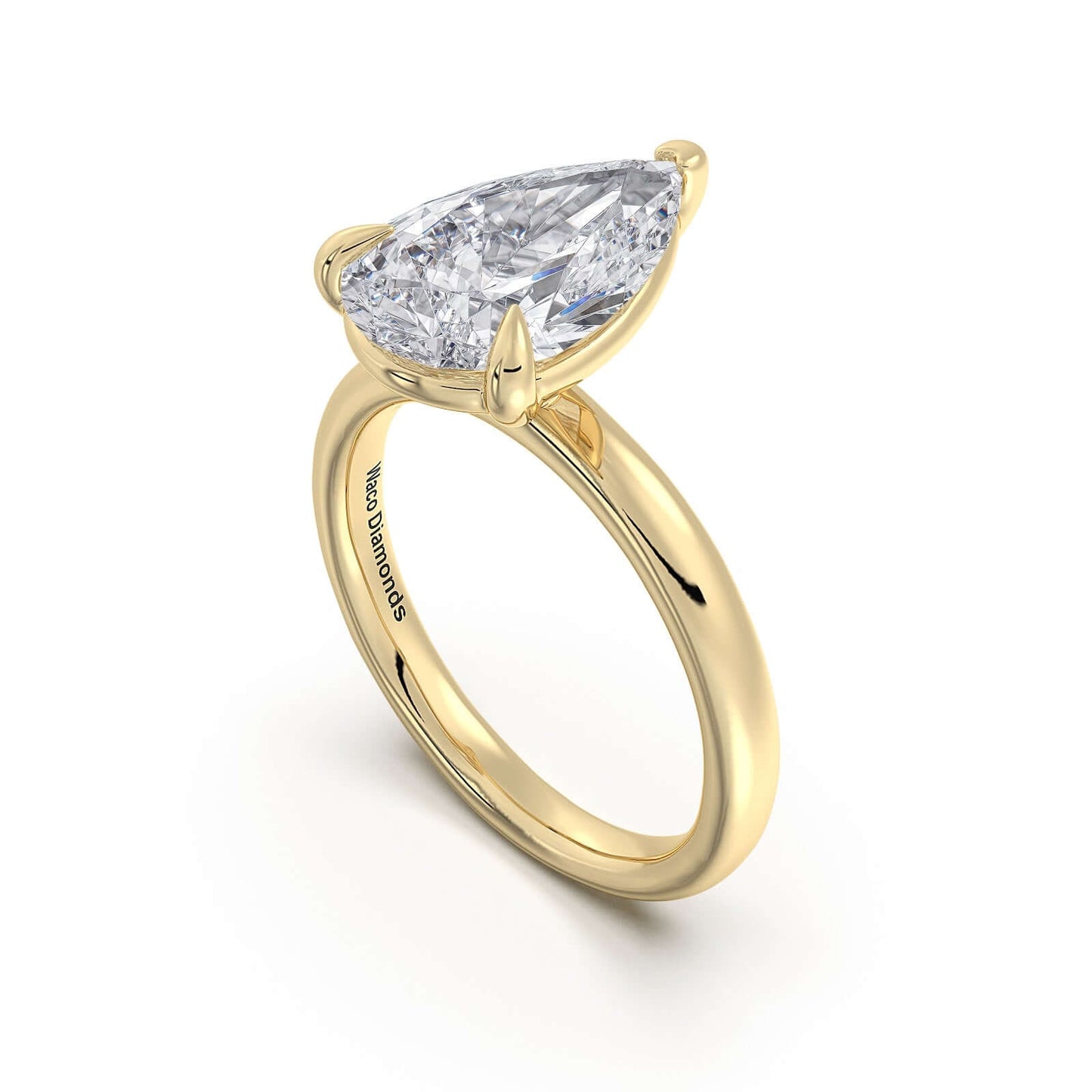 Yellow Gold Pear Diamond Engagement Ring with Solitaire Band | Waco Diamonds Is Located In Waco, TX | Central Texas' #1 Engagement Ring Store With Lifetime Warranty
