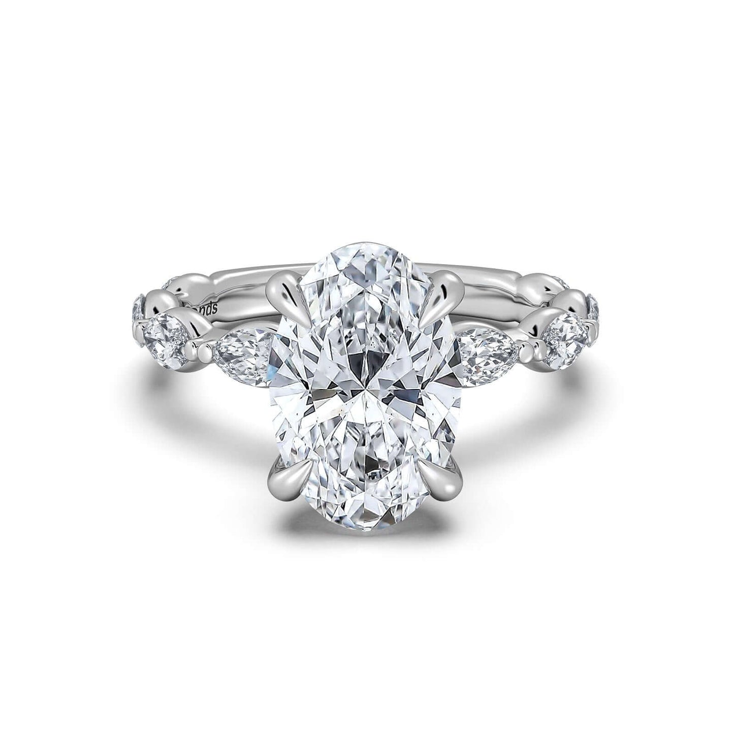 White Gold Oval Diamond Engagement Ring with Marquise Side Stone Band | Waco Diamonds Is Located In Waco, TX | Central Texas' #1 Engagement Ring Store With Lifetime Warranty