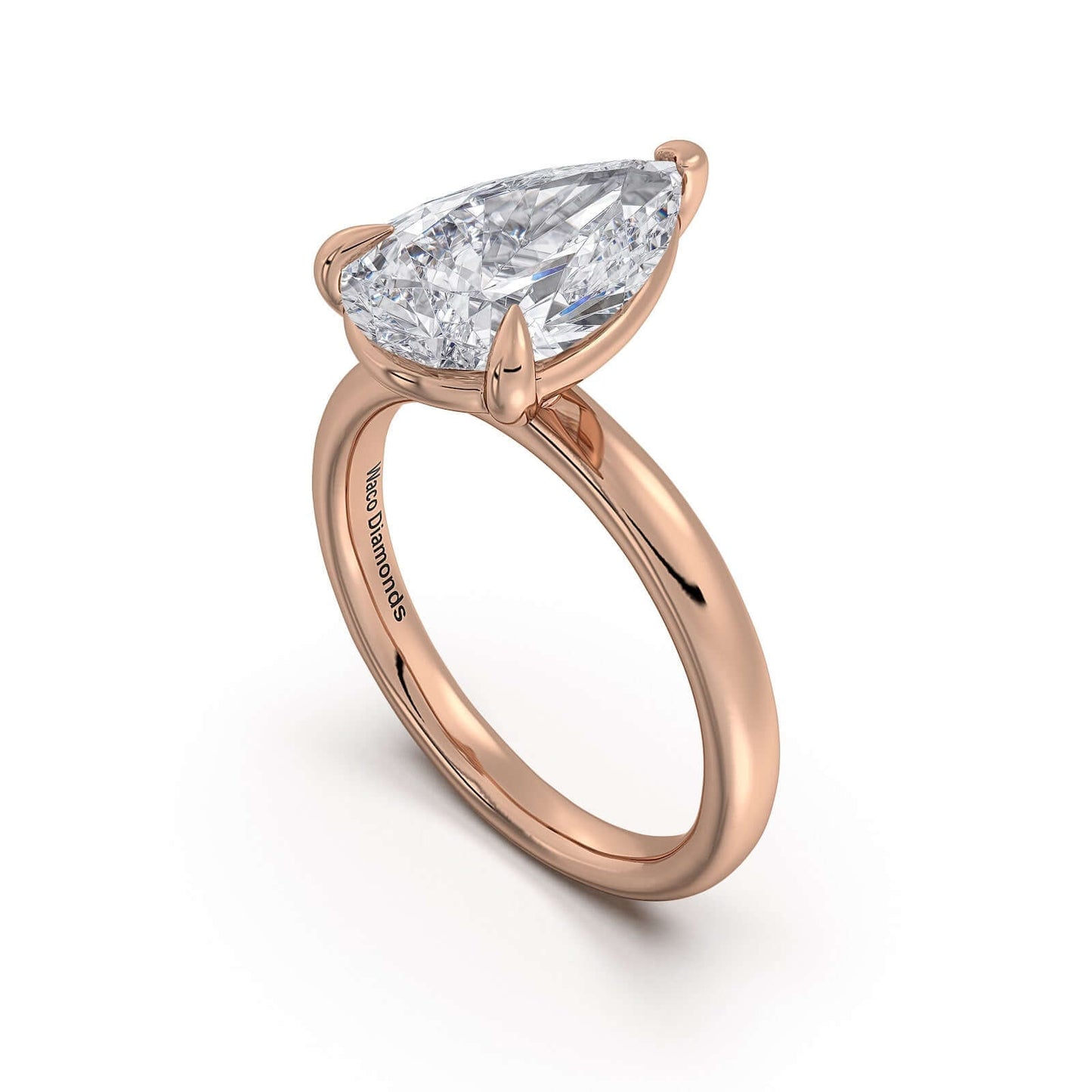 Rose Gold Pear Diamond Engagement Ring with Solitaire Band | Waco Diamonds Is Located In Waco, TX | Central Texas' #1 Engagement Ring Store With Lifetime Warranty