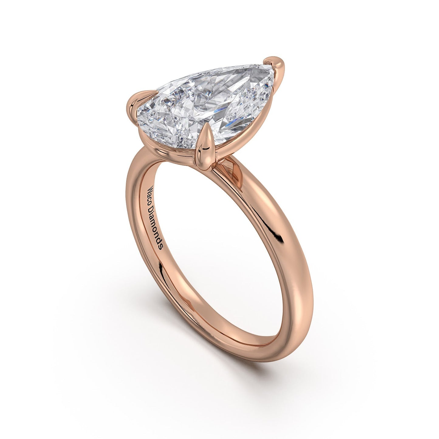 Rose Gold Pear Diamond Engagement Ring with Solitaire Band | Waco Diamonds Is Located In Waco, TX | Central Texas' #1 Engagement Ring Store With Lifetime Warranty